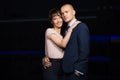 Happy young fashion couple in love walking on the city street at night Royalty Free Stock Photo