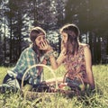 Happy young fashion girls with a fruit basket on nature Royalty Free Stock Photo