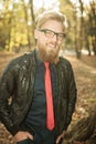 Happy young fashion man walking in the park Royalty Free Stock Photo