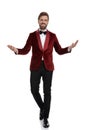 Happy young fashion man wearing red velvet tuxedo Royalty Free Stock Photo