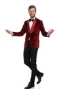 Happy young fashion man wearing red velvet tuxedo Royalty Free Stock Photo