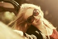 Happy young fashion woman next to her car