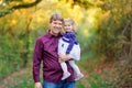 Happy young father having fun cute toddler daughter, family portrait together. man with beautiful baby girl in nature Royalty Free Stock Photo