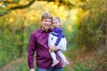 Happy young father having fun cute toddler daughter, family portrait together. man with beautiful baby girl in nature Royalty Free Stock Photo