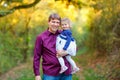 Happy young father having fun cute toddler daughter, family portrait together. man with beautiful baby girl in nature Royalty Free Stock Photo