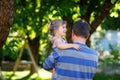 Happy young father having fun cute toddler daughter, family portrait together. man with beautiful baby girl in summer Royalty Free Stock Photo