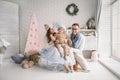 Happy young father mother and baby boy in christmas studio Royalty Free Stock Photo