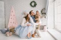 Happy young father mother and baby boy in christmas studio Royalty Free Stock Photo