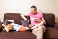 Happy young father sit on computer using laptop with son having a video call. Smiling dad sitting and little boy child Royalty Free Stock Photo