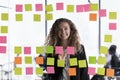 Happy young female business leader head shot through glass portrait Royalty Free Stock Photo