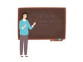Happy young female college teacher, university professor, lecturer or educational worker standing beside chalkboard