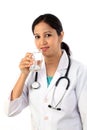 Happy young female doctor with a glass of water