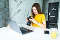 Happy young female executive looking at camera in creative office. Freelance photographer woman with camera at home office editing Royalty Free Stock Photo