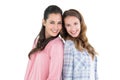 Happy young female friends standing back to back Royalty Free Stock Photo