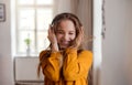 A young female student with headphones having fun.