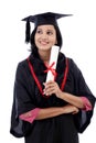 Happy young female student holding diploma Royalty Free Stock Photo