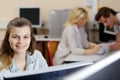 happy young female student using computer Royalty Free Stock Photo