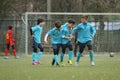 Happy young football players after a goal