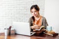 Happy Young Freelancer Woman Working on Computer Laptop in Cozy