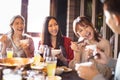 Young friends eating hot pot in restaurant Royalty Free Stock Photo