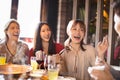 Young friends enjoy dinner in hot pot restaurant Royalty Free Stock Photo