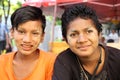 Happy young friends working in street market, Myanmar