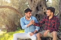 Happy gay couple in park