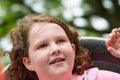 Happy Young Girl on Amusement Ride with Hair Blowing in Wind Royalty Free Stock Photo