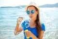 Happy young girl blowing soap bubbles on the seashore Royalty Free Stock Photo