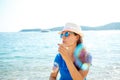 Happy young girl blowing soap bubbles on the seashore Royalty Free Stock Photo