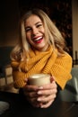 Happy young girl in cafe with glass of coffee. Positive emotions and smile Royalty Free Stock Photo