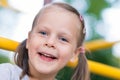 Happy young girl close up portrait outdoors