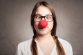 Happy young girl with a clown nose Royalty Free Stock Photo