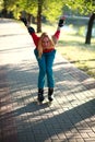 Happy young girl enjoying roller skating in park Royalty Free Stock Photo