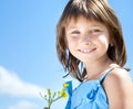 Happy young girl with a flower in his hand