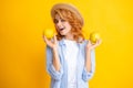Happy young girl holding apple isolated over yellow background. Portrait of pretty woman with an apple close up. Royalty Free Stock Photo
