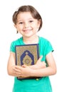 Happy young girl holding Quraan Royalty Free Stock Photo