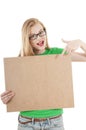 Happy young girl holds up empty notice board. Royalty Free Stock Photo