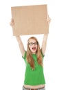 Happy young girl holds up empty notice board. Royalty Free Stock Photo