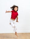 Happy young girl jumping for positive energy and fun sports Royalty Free Stock Photo