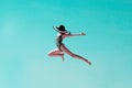 Happy young girl jumping up to the sky. People, happiness, travel concept. Royalty Free Stock Photo