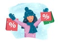 Happy young girl makes shopping for the holidays in a snowy winter day