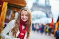 Happy young girl on a Parisian Christmas market Royalty Free Stock Photo