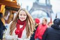 Happy young girl on a Parisian Christmas market Royalty Free Stock Photo