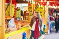 Happy young girl on a Parisian Christmas market Royalty Free Stock Photo