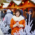 Happy young girl on a Parisian Christmas market Royalty Free Stock Photo