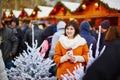 Happy young girl on a Parisian Christmas market Royalty Free Stock Photo