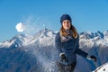 Happy young girl playing snowball fight on the winter snow day