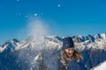 Happy young girl playing snowball fight on the winter snow day