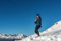 Happy young girl playing snowball fight on the winter snow day